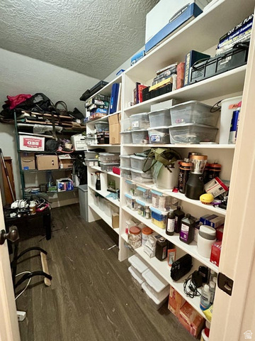 310 625 East Enterprise, UT 84725 - Photo 32 of 36 Built-in shelving, wood-finish flooring, and white painted walls