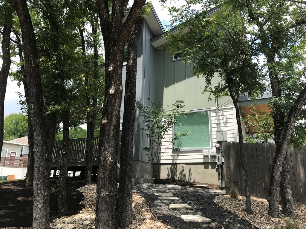 1309 Delano Street, Unit 1 Austin, TX 78721 - Photo 1 of 1 a view of a house with a tree in the background