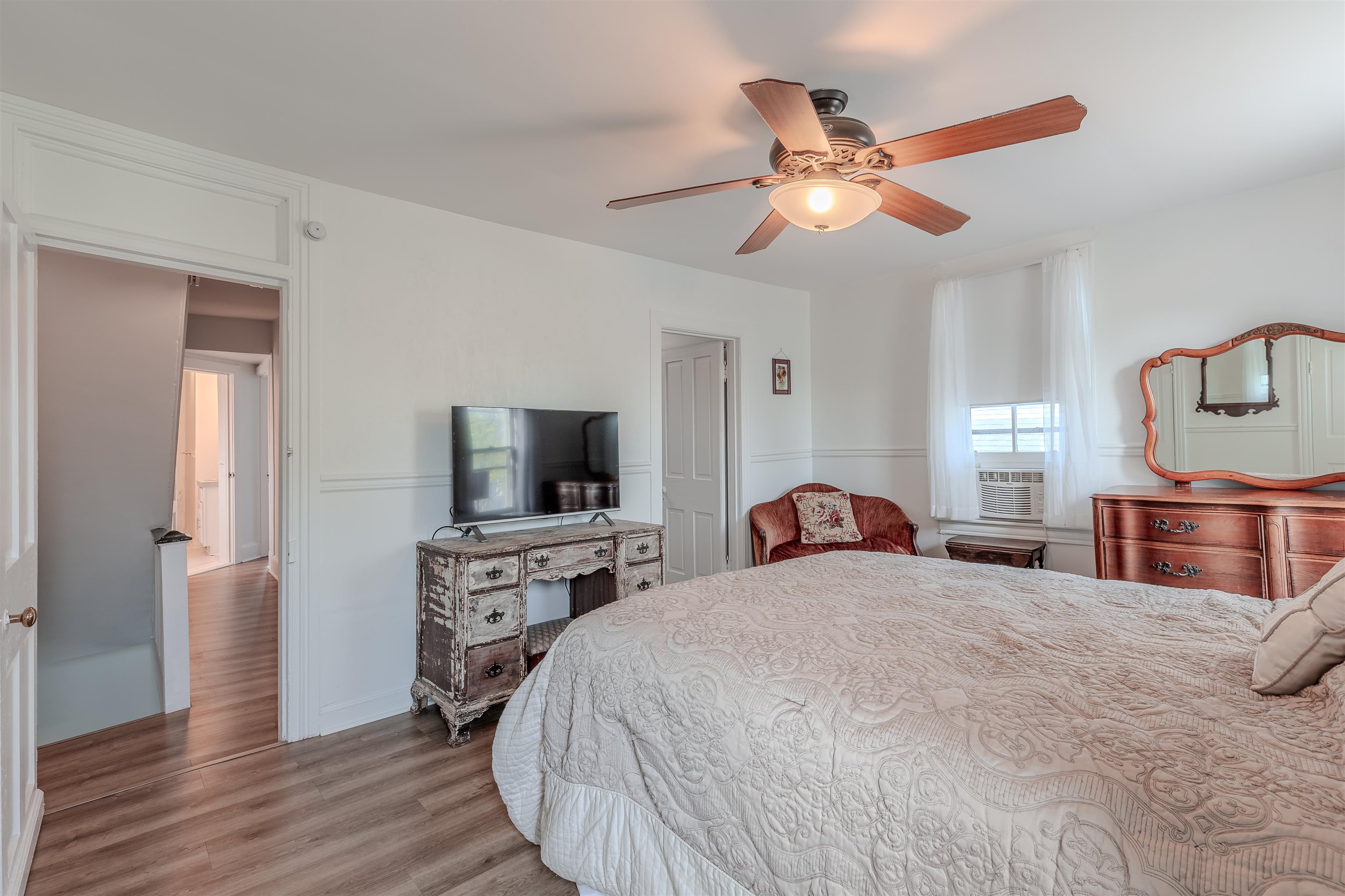 127 3rd West Cape May, NJ 08204 - Photo 19 of 38 a bedroom with a bed and a flat tv screen on dresser