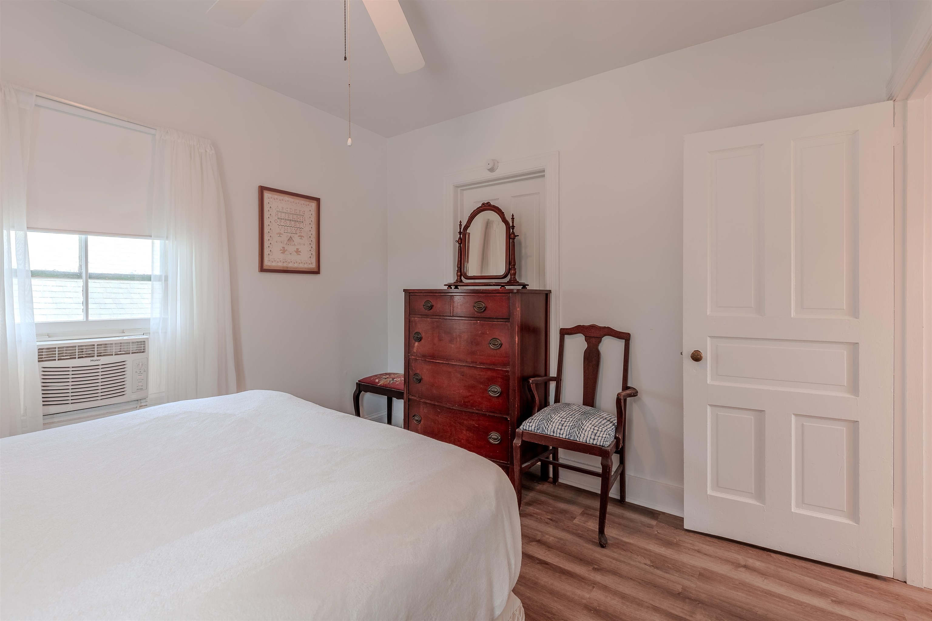 127 3rd West Cape May, NJ 08204 - Photo 29 of 38 a bedroom with a bed wooden floor and window