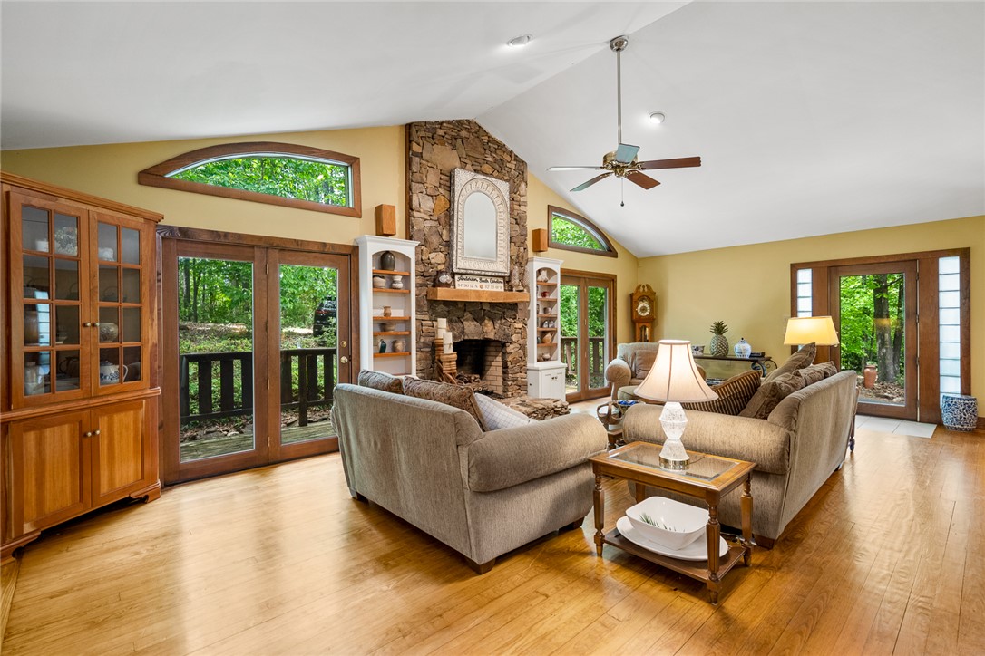 324 Hobson Road Anderson, SC 29621 - Photo 10 of 46 This inviting living space features warm hardwood floors and a striking stone fireplace.