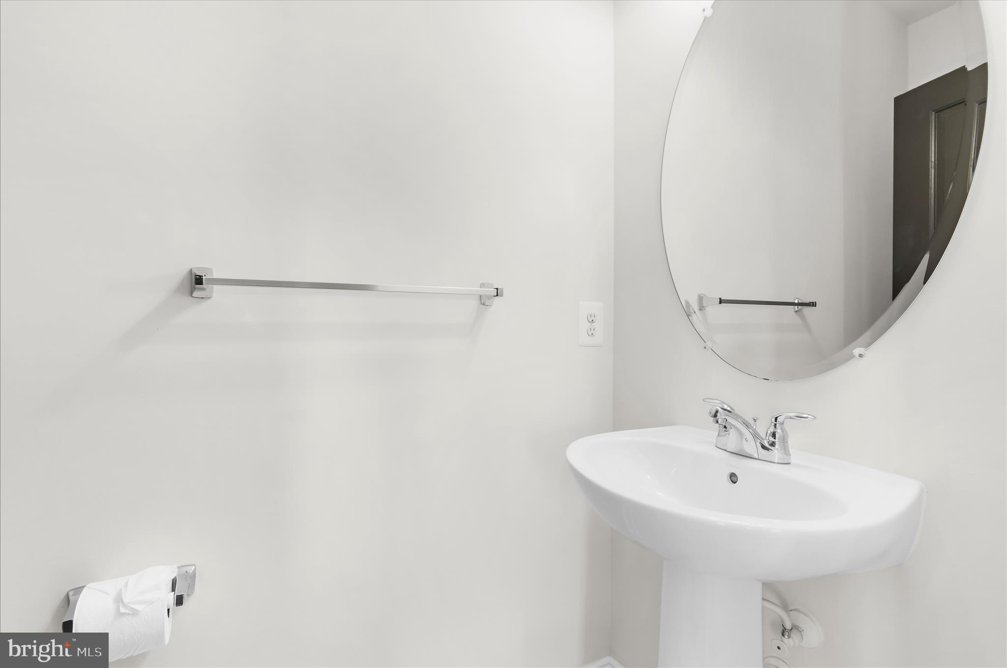 1704 Fieldstone Court Hanover, MD 21076 - Photo 12 of 47 a bathroom with a sink a mirror and a shower