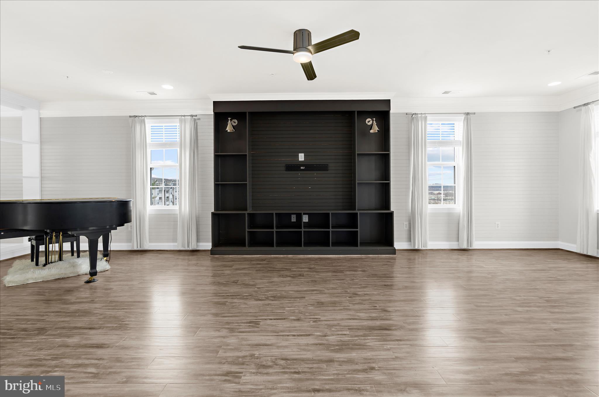 1704 Fieldstone Court Hanover, MD 21076 - Photo 13 of 47 a view of a livingroom with a hardwood floor and a ceiling fan