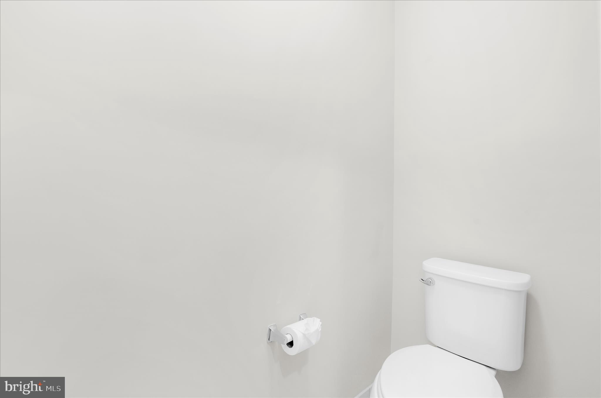 1704 Fieldstone Court Hanover, MD 21076 - Photo 29 of 47 a white toilet sitting next to a white wall