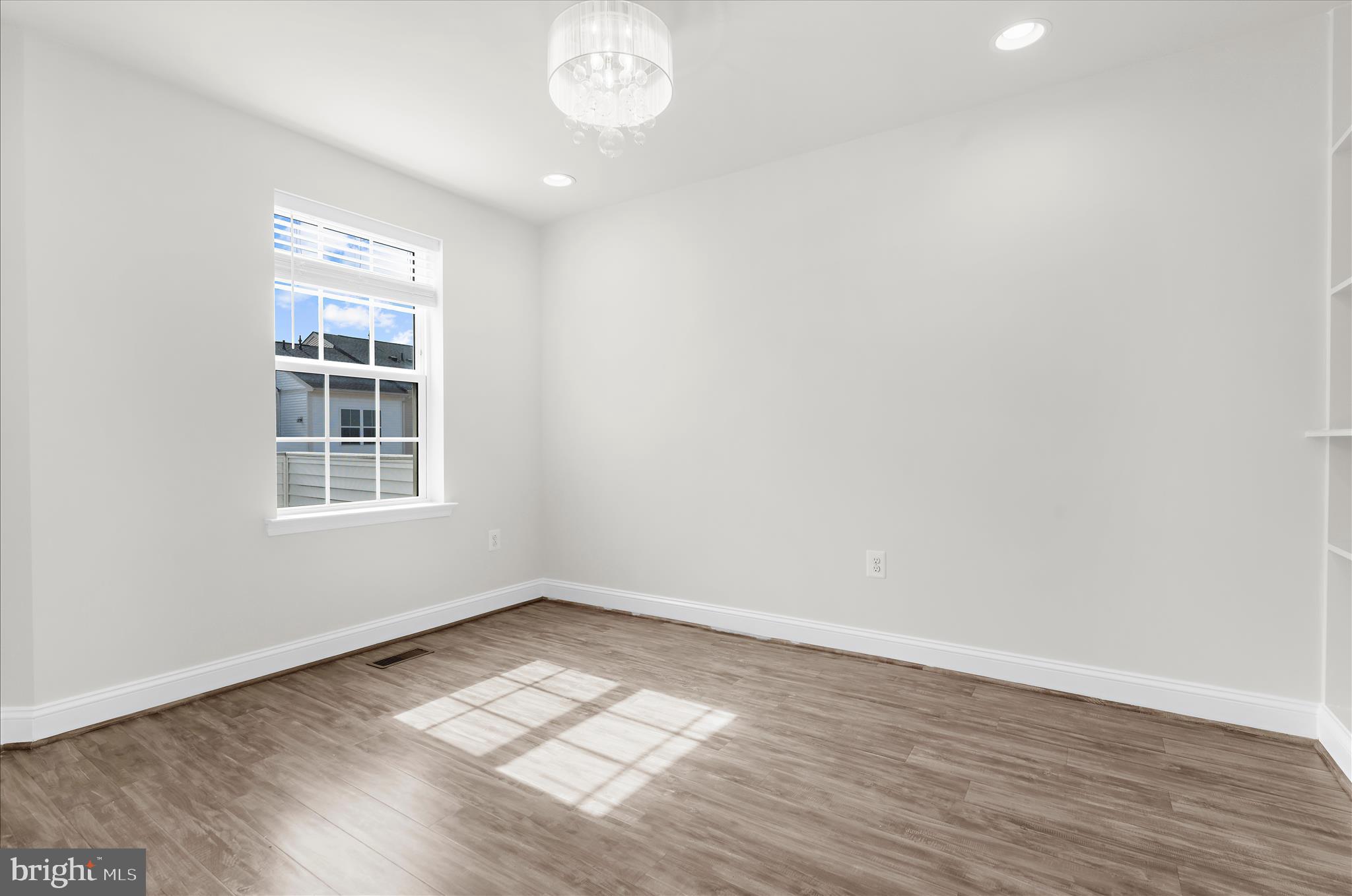1704 Fieldstone Court Hanover, MD 21076 - Photo 31 of 47 wooden floor in an empty room with a window