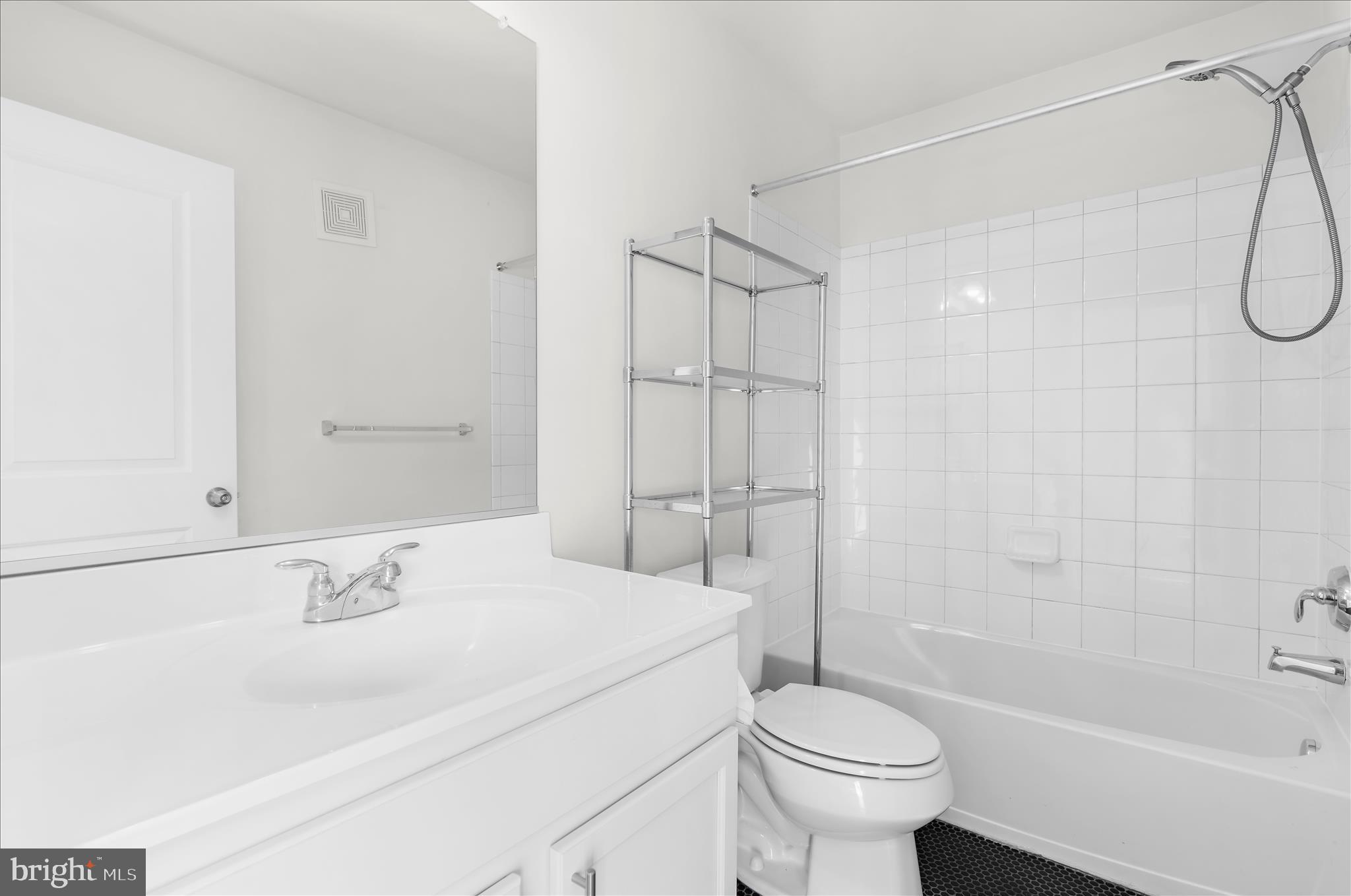 1704 Fieldstone Court Hanover, MD 21076 - Photo 33 of 47 a bathroom with a sink toilet tub and shower
