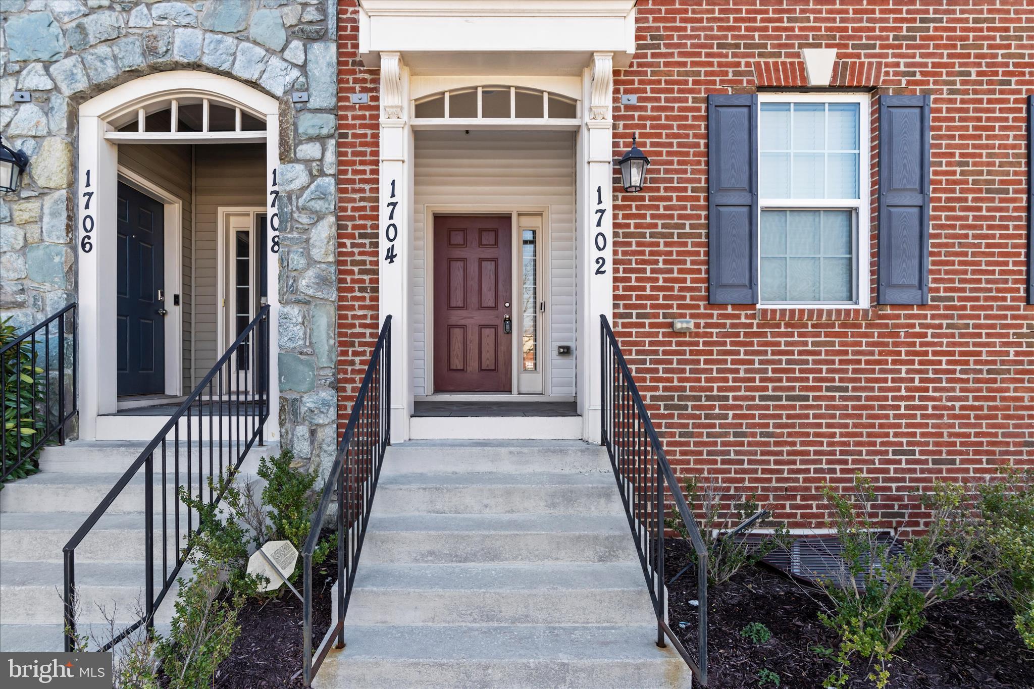 1704 Fieldstone Court Hanover, MD 21076 - Photo 5 of 47 a view of a brick house with flower plants
