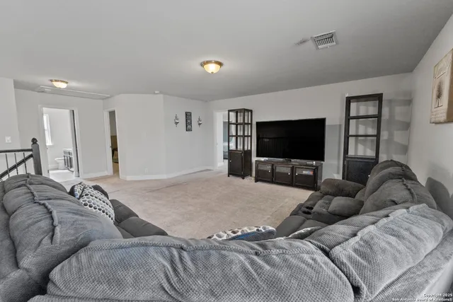 a living room with a couch and a flat screen tv