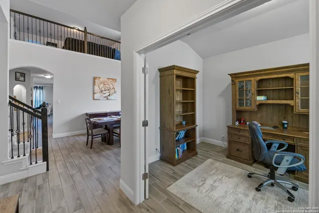 a view of a workspace with furniture and a bedroom