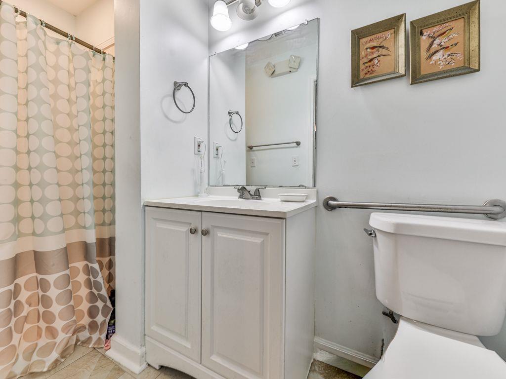 3605 Shallowford Road Marietta, GA 30062 - Photo 17 of 42 a bathroom with a toilet sink and shower