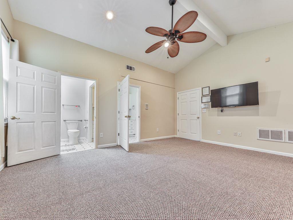 3605 Shallowford Road Marietta, GA 30062 - Photo 23 of 42 an empty room with chandelier fan and windows