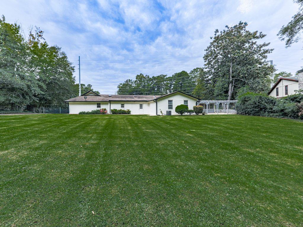 3605 Shallowford Road Marietta, GA 30062 - Photo 34 of 42 a swimming pool with wooden fence