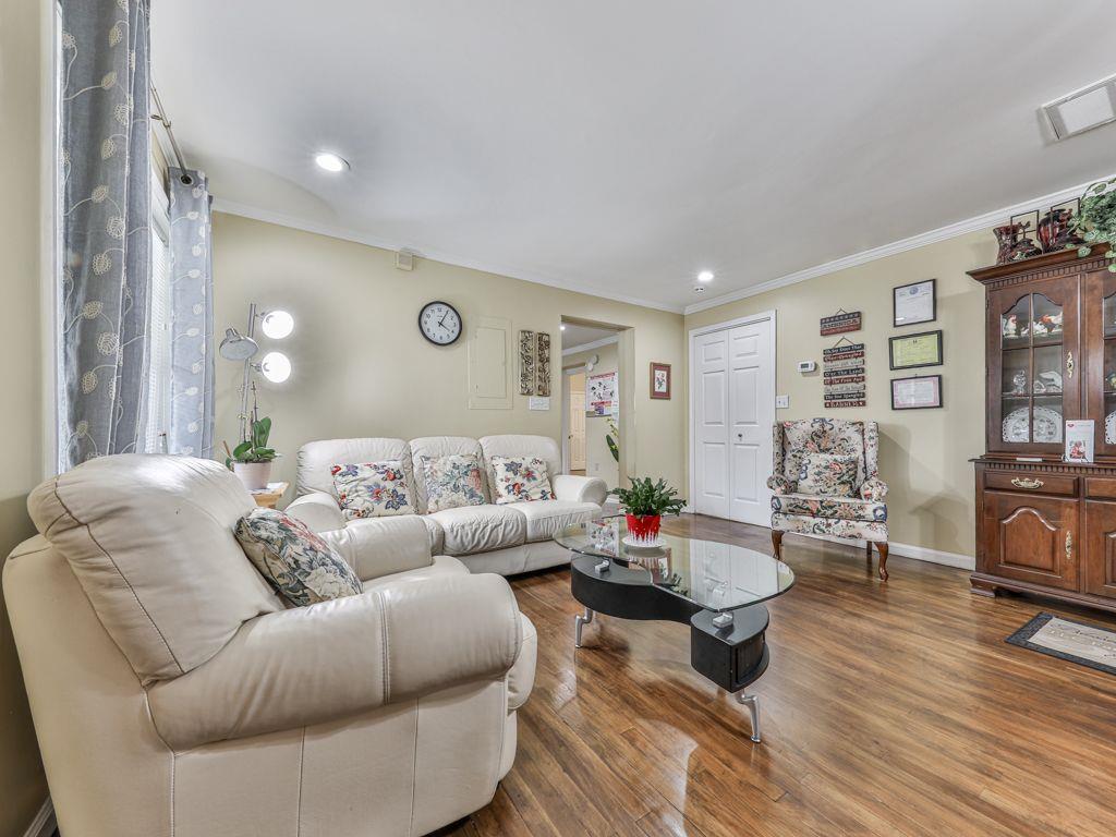 3605 Shallowford Road Marietta, GA 30062 - Photo 5 of 42 a living room with furniture a rug and a flat screen tv