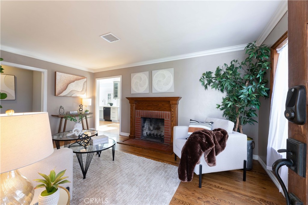 474 East 44th Circle Long Beach, CA 90807 - Photo 7 of 31 front living room with wood fireplacd