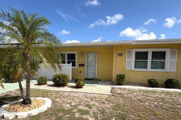 1005 Rickenbacker Drive Sun City Center, FL 33573 - Photo 1 of 57 a front view of a house with a yard