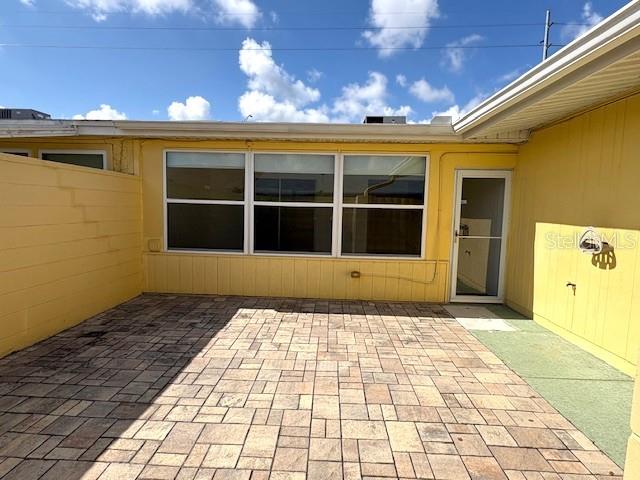 1005 Rickenbacker Drive Sun City Center, FL 33573 - Photo 20 of 57 a view of a brick house with a large window