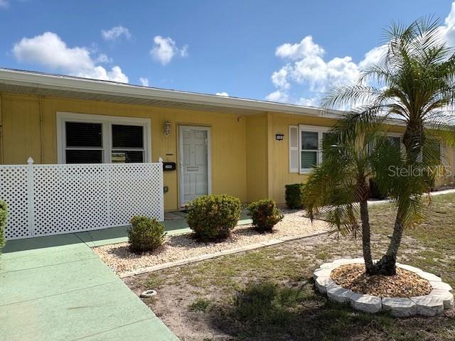 1005 Rickenbacker Drive Sun City Center, FL 33573 - Photo 2 of 57 a view of a house with backyard and sitting area