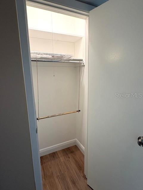 1005 Rickenbacker Drive Sun City Center, FL 33573 - Photo 25 of 57 a view of an empty room with wooden floor and a window