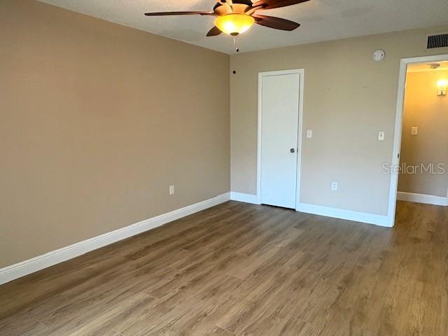 1005 Rickenbacker Drive Sun City Center, FL 33573 - Photo 37 of 57 a view of an empty room and wooden floor