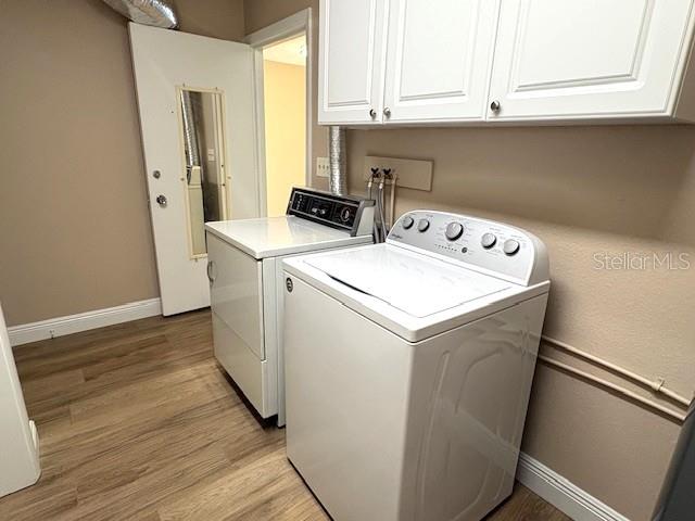 1005 Rickenbacker Drive Sun City Center, FL 33573 - Photo 45 of 57 a utility room with dryer and washer
