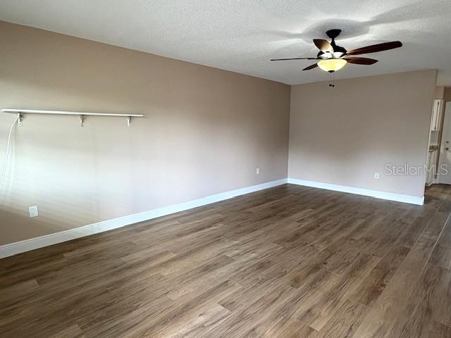 1005 Rickenbacker Drive Sun City Center, FL 33573 - Photo 5 of 57 a view of an empty room with wooden floor