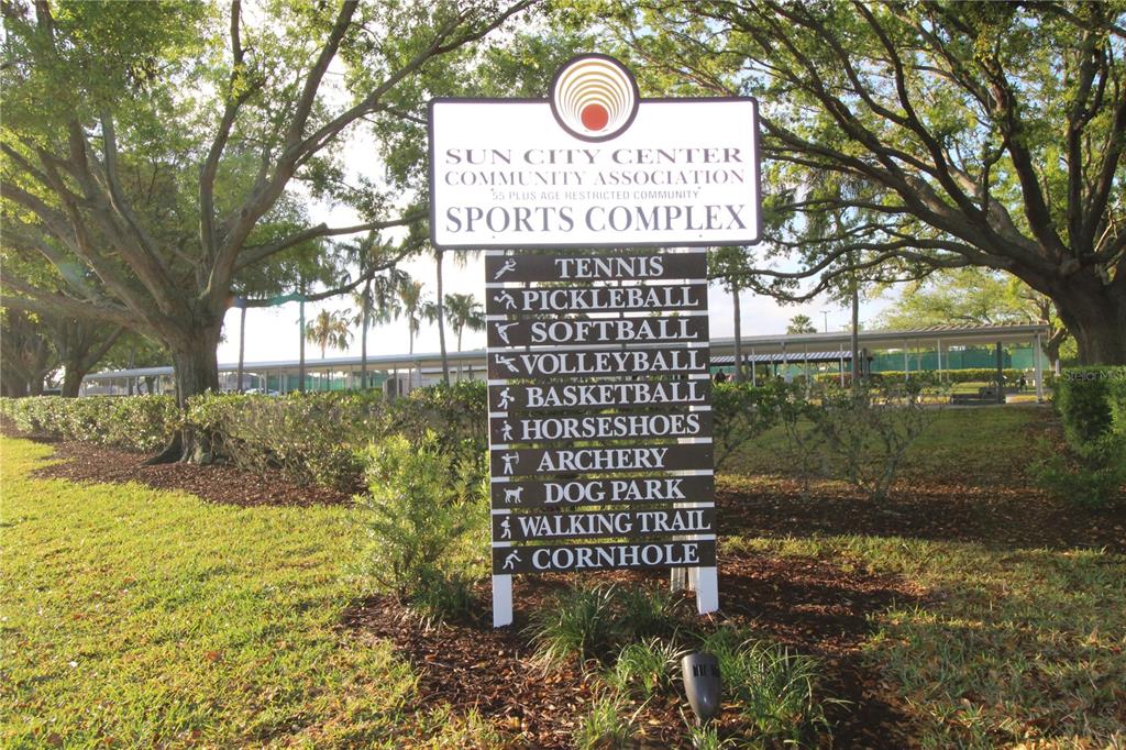 1005 Rickenbacker Drive Sun City Center, FL 33573 - Photo 55 of 57 a sign on the side of a road