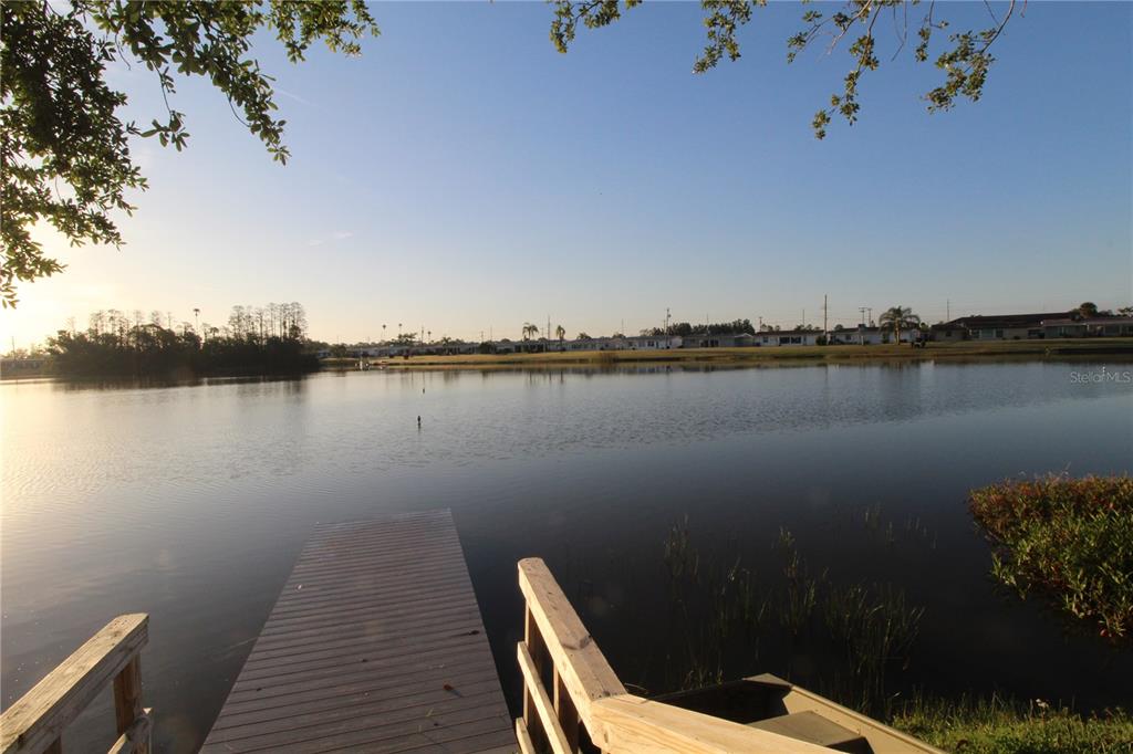 1005 Rickenbacker Drive Sun City Center, FL 33573 - Photo 57 of 57 a view of a lake with sitting area