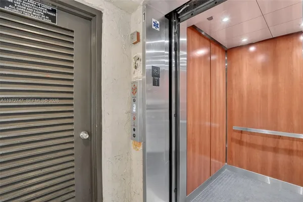 a bathroom with a mirror and a shower