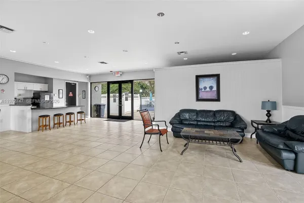 a living room with furniture and a table