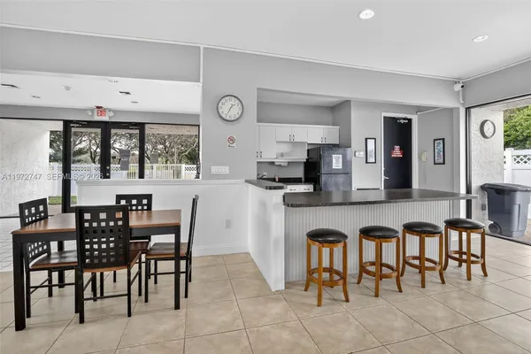 a view of a dining area with furniture and window