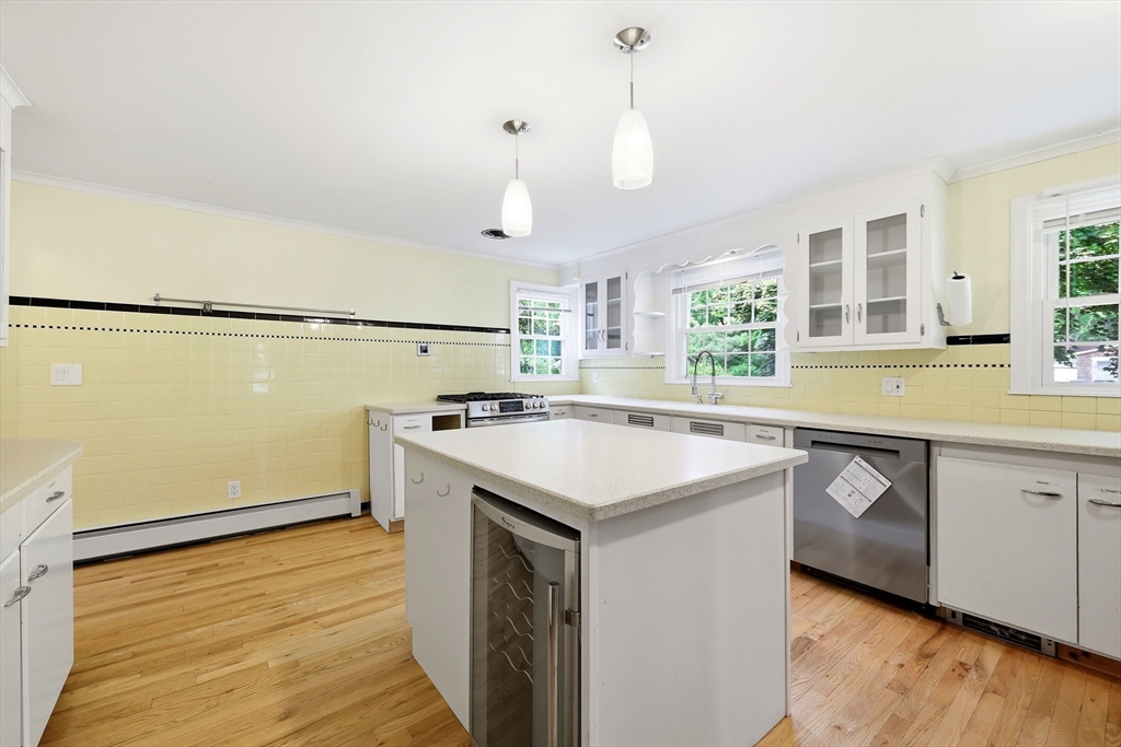 130 Connecticut Avenue Springfield, MA 01107 - Photo 19 of 40 a kitchen with a sink a stove a refrigerator and white cabinets