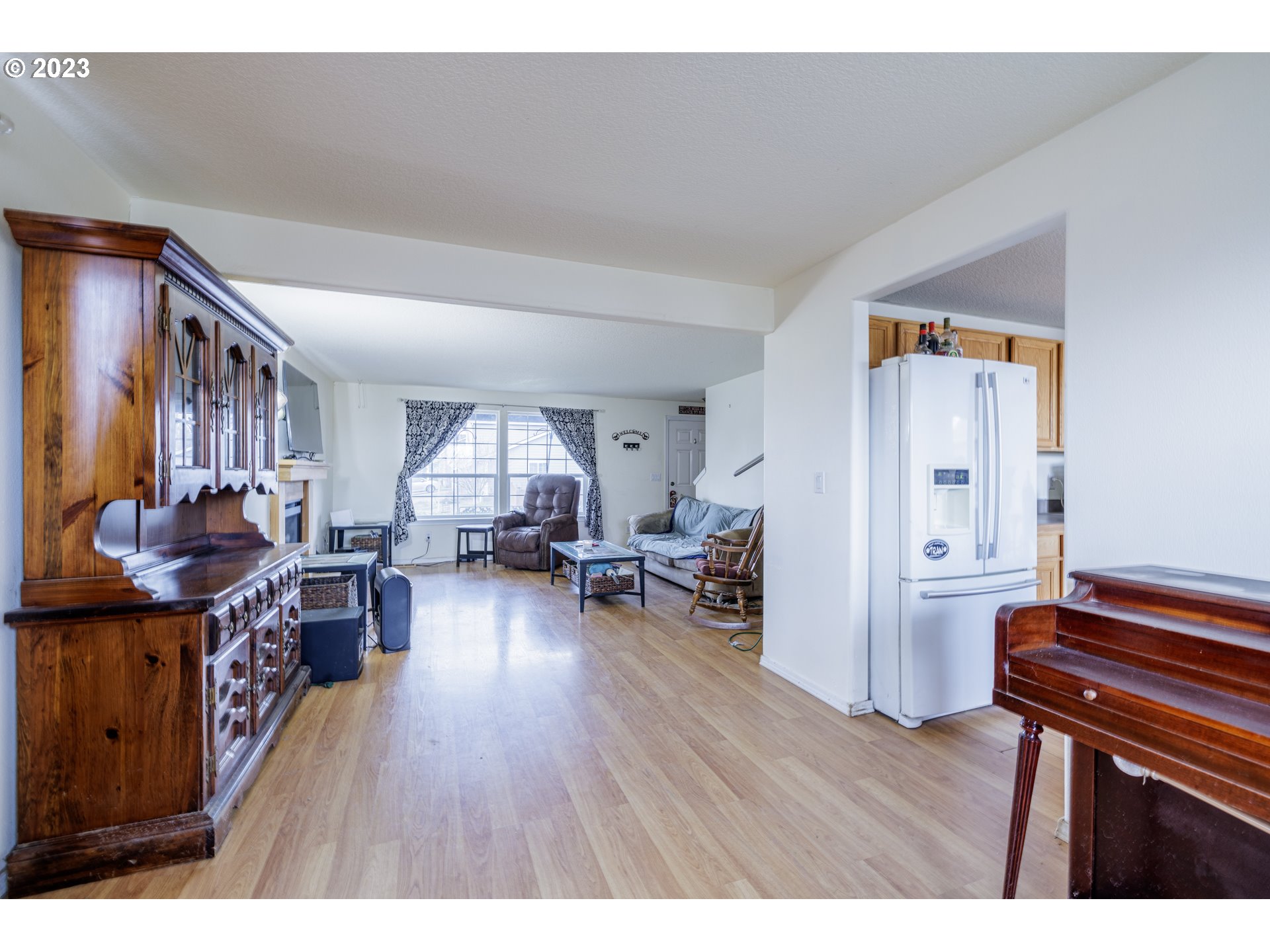 11049 Rees Street Northeast Donald, OR 97020 - Photo 2 of 14 a living room with furniture and wooden floor