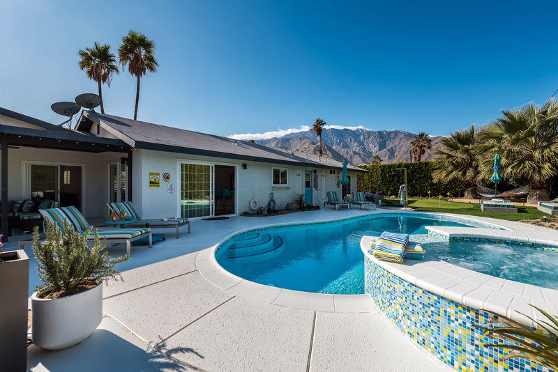 426 East Simms Road Palm Springs, CA 92262 - Photo 22 of 58 a view of a house with swimming pool and sitting area