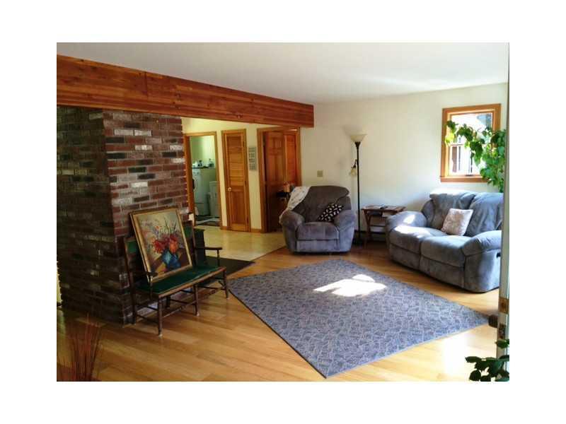 18 Howards Hill Road Harpswell, ME 04079 - Photo 10 of 31 Living Room. The exposed center...