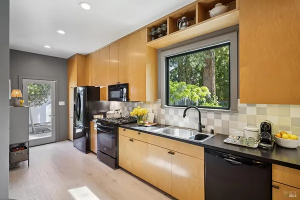 a kitchen with a sink and a window