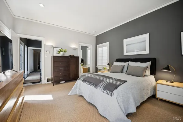 a bedroom with a bed and a table in it
