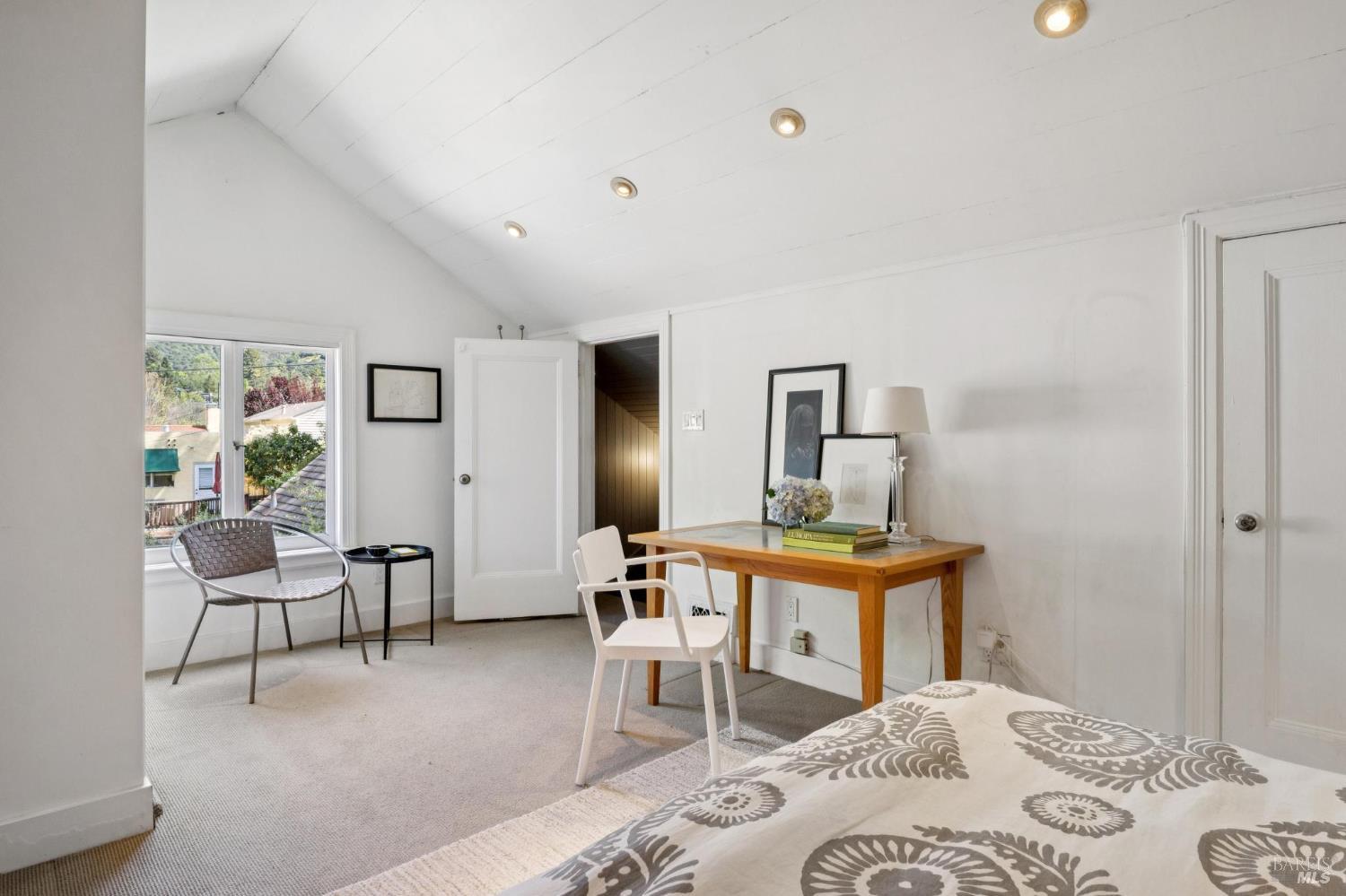 22 Clyde Avenue San Rafael, CA 94901 - Photo 32 of 66 a bedroom with a bed and a table in it