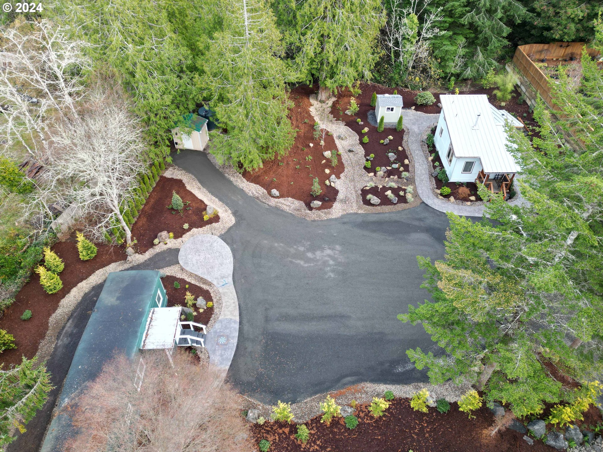 an aerial view of a house with outdoor space
