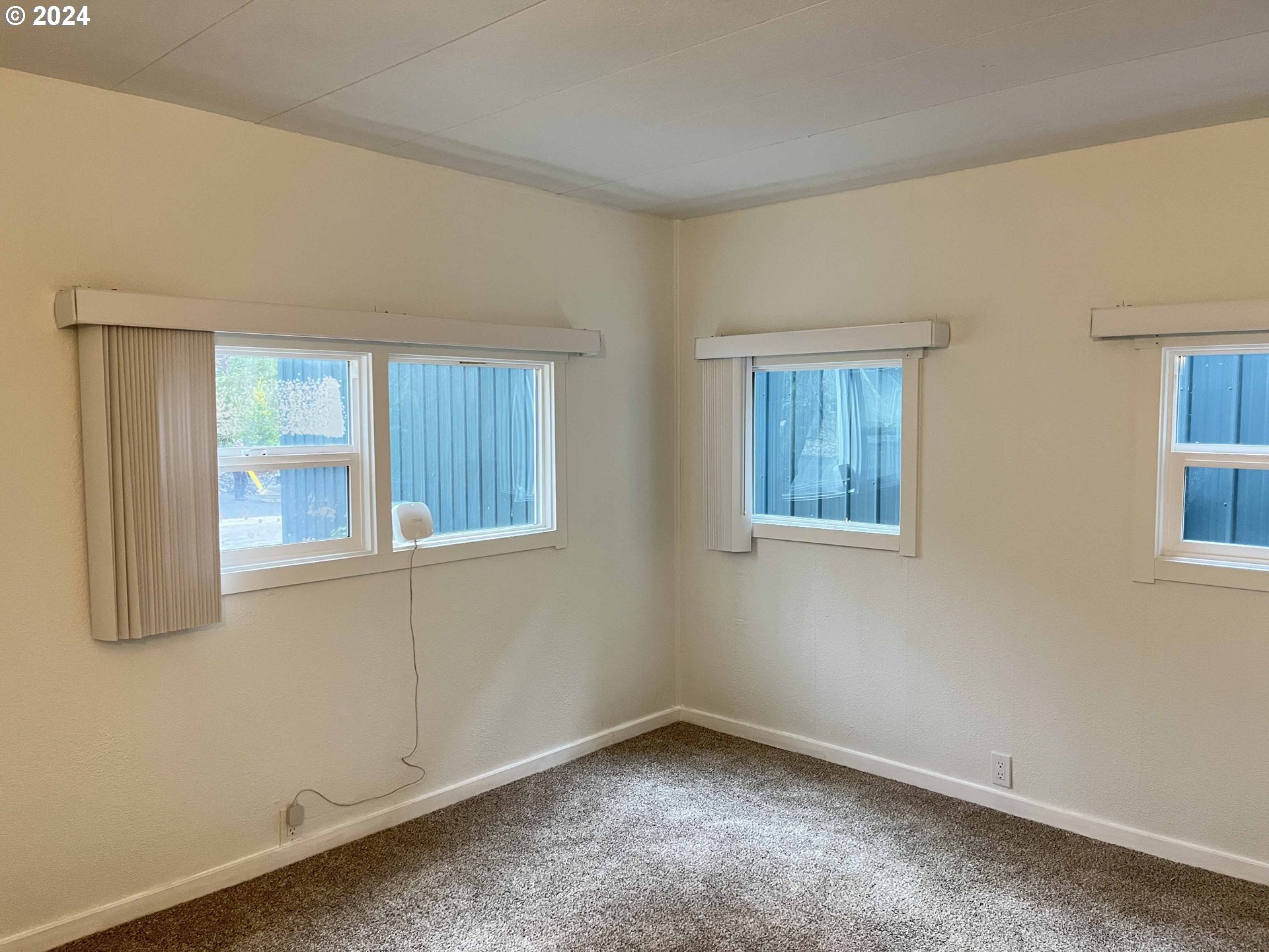 85313 Glenada Road Florence, OR 97439 - Photo 27 of 48 a view of an empty room with a window