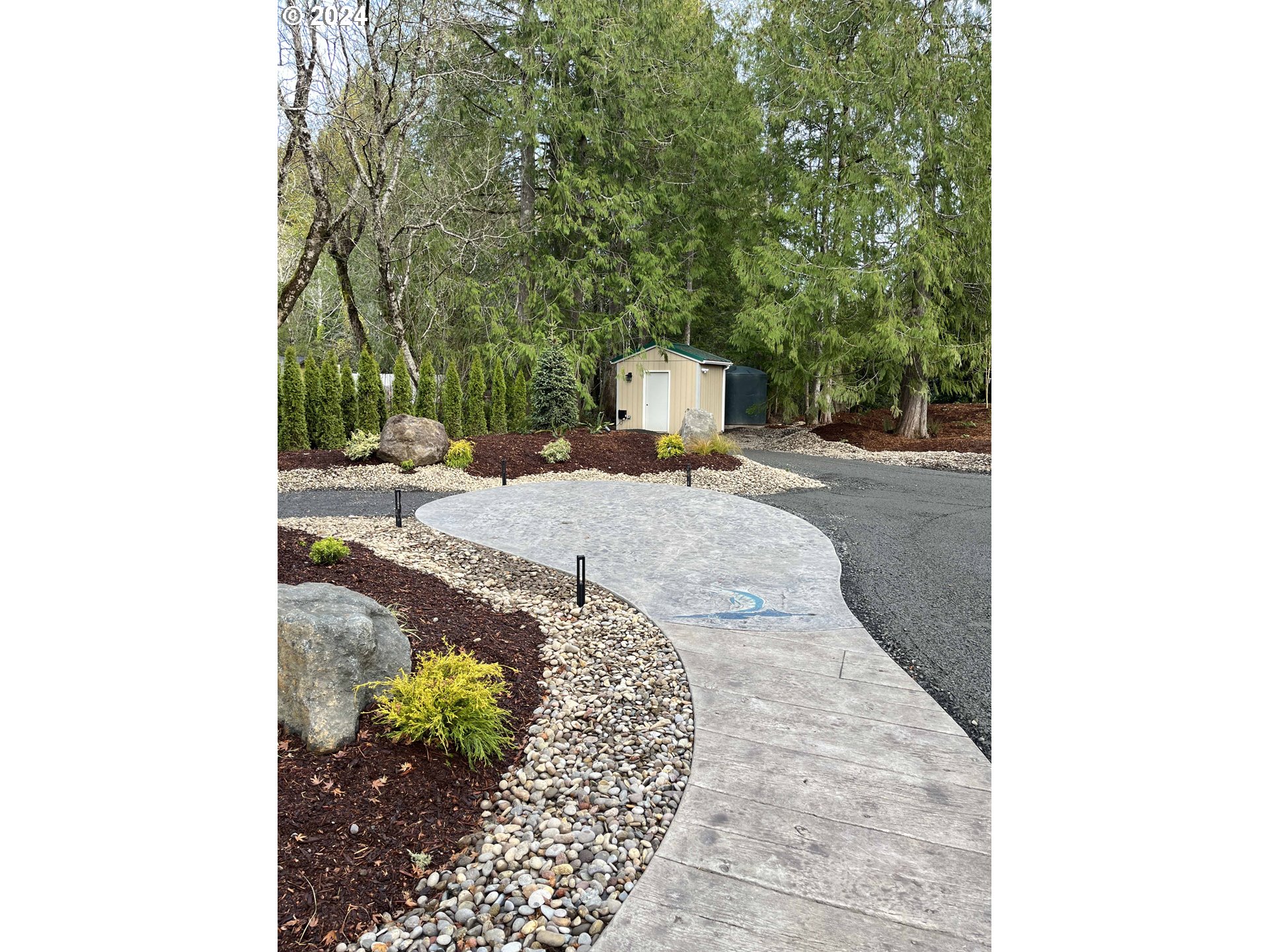 85313 Glenada Road Florence, OR 97439 - Photo 33 of 48 a view of a backyard with large trees