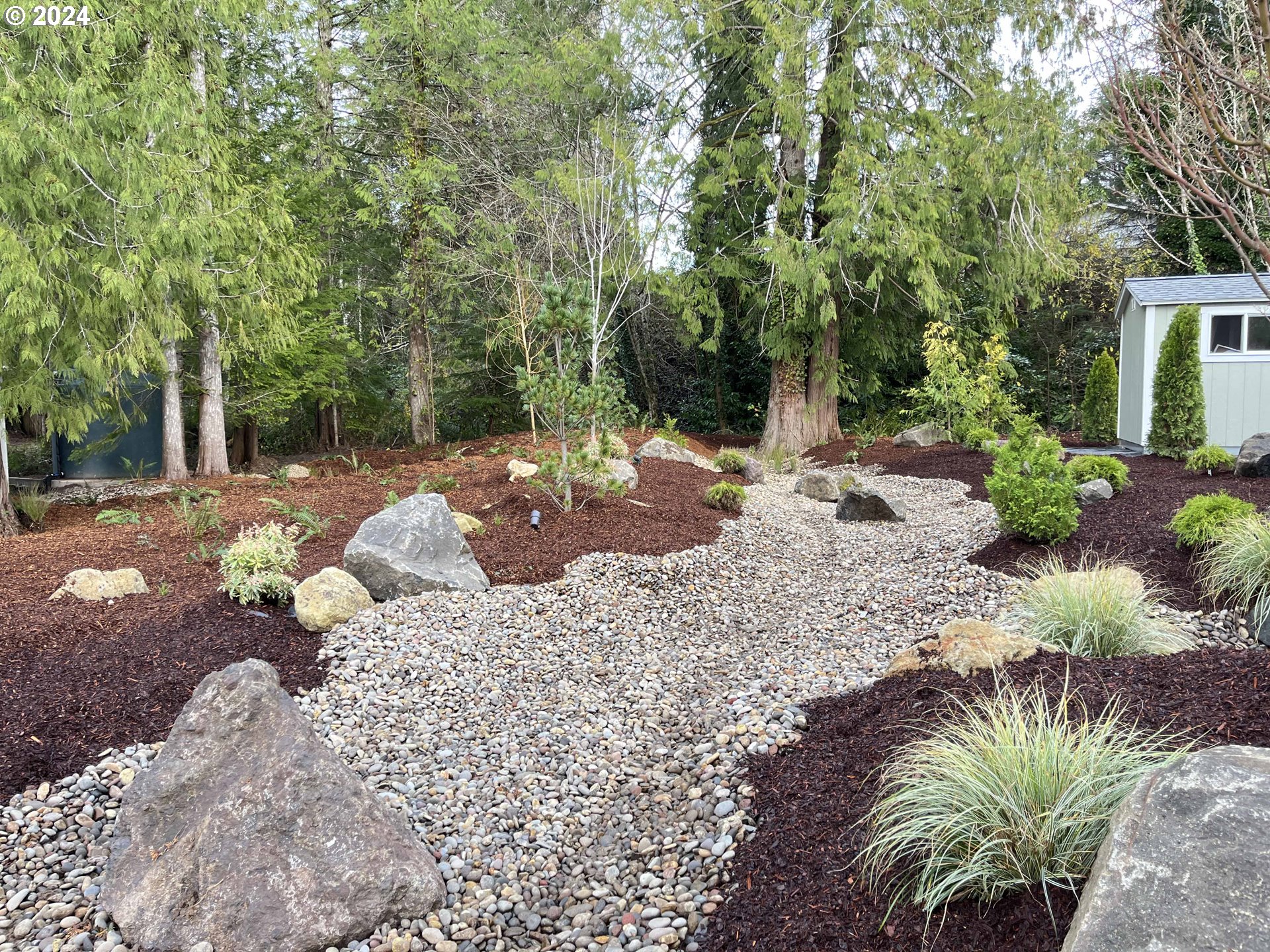 85313 Glenada Road Florence, OR 97439 - Photo 36 of 48 a view of a backyard with a fountain