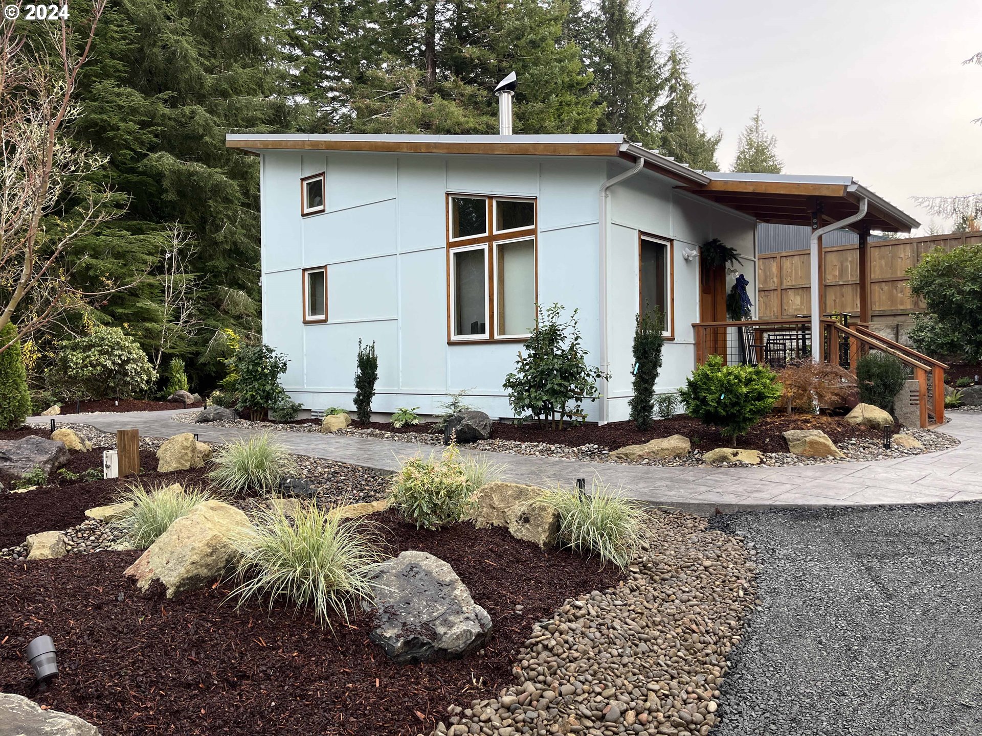 85313 Glenada Road Florence, OR 97439 - Photo 37 of 48 a front view of a house with a yard