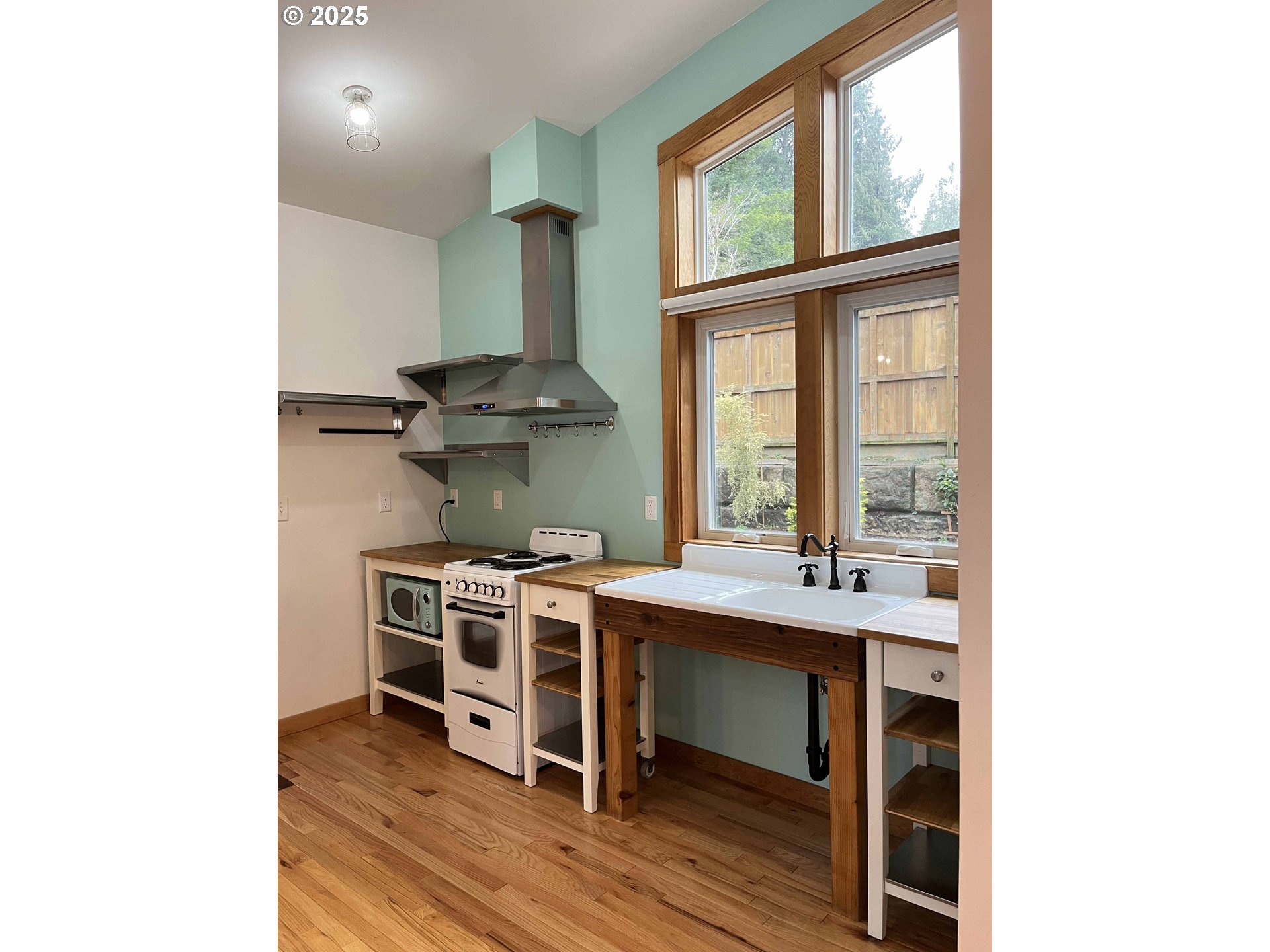 85313 Glenada Road Florence, OR 97439 - Photo 43 of 48 a kitchen with a stove and a window