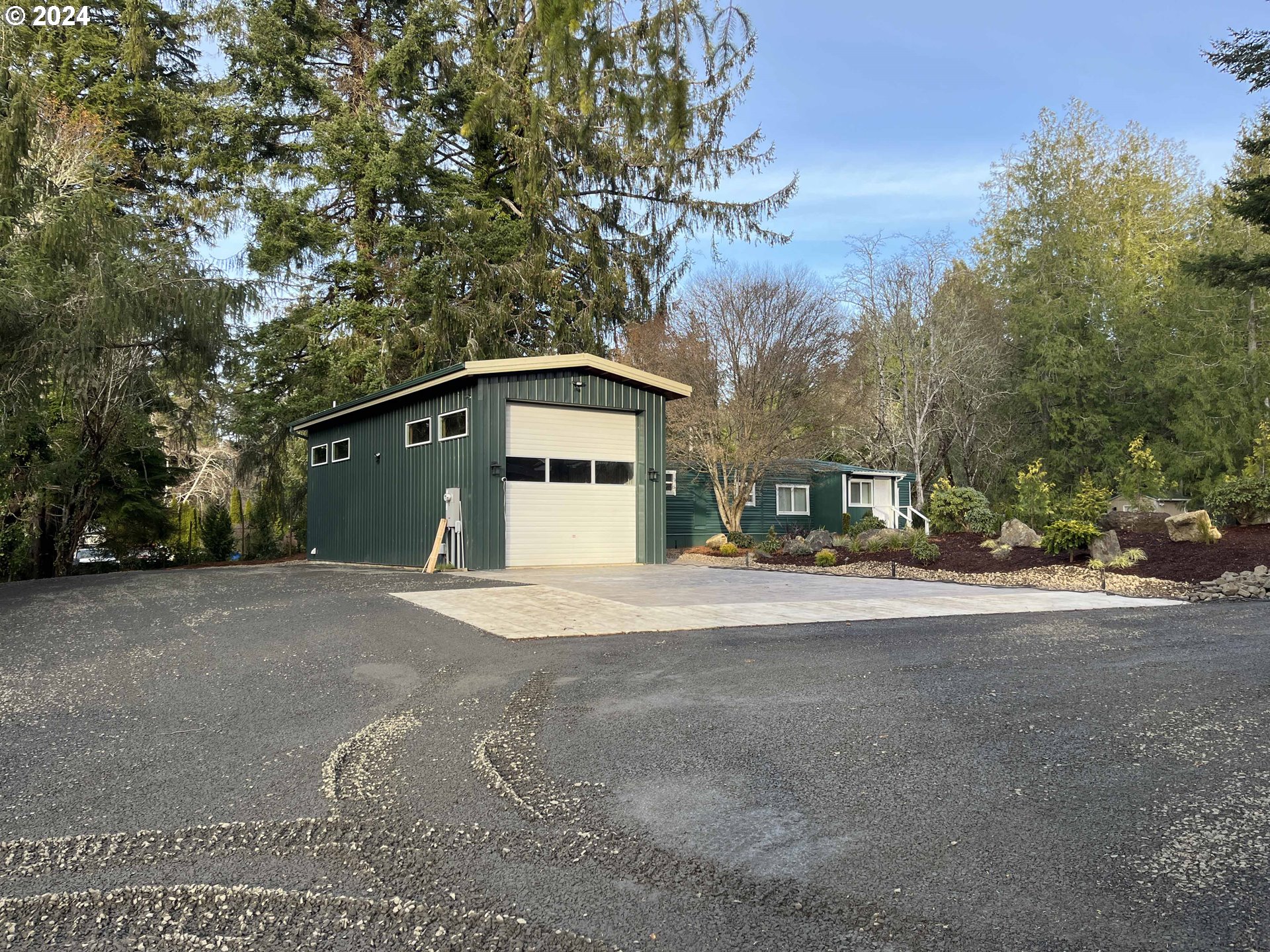 85313 Glenada Road Florence, OR 97439 - Photo 7 of 48 a front view of a house with a yard and garage