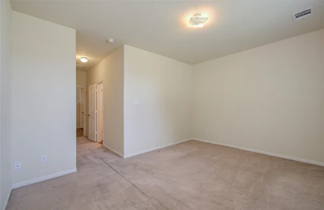 a bathroom with a granite countertop sink and a window