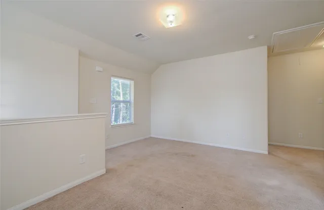 a view of an empty room and window