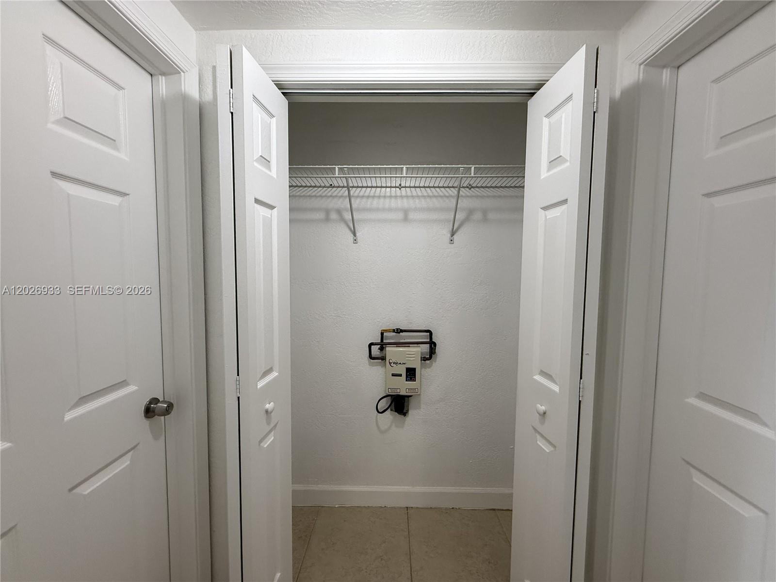 421 Southwest 6th Street, Unit 7 Miami, FL 33130 - Photo 4 of 8 a bathroom with a glass door