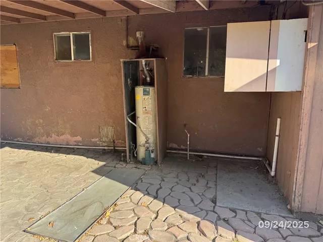 a view of kitchen with furniture and a fireplace