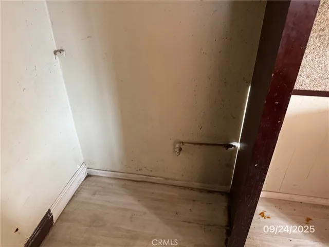 a bathroom with a granite countertop sink a toilet and mirror