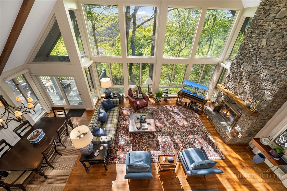246 Mulberry Lane Boone, NC 28607 - Photo 42 of 49 a living room with furniture and a large window